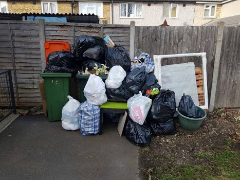 Person filling out a skip hire permit application.